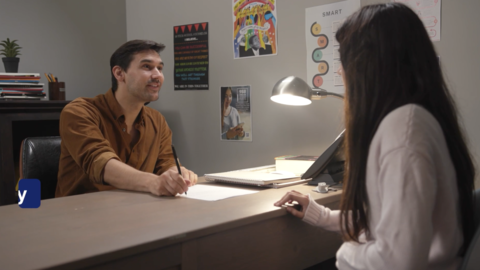 A counselor with a student