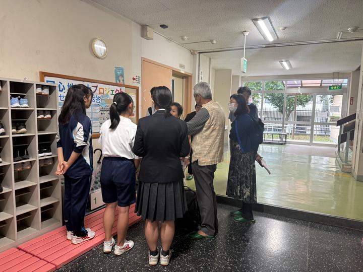 Vikram Patel meeting with collaborators at a school in Tokyo