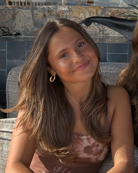 A woman in a brown dress